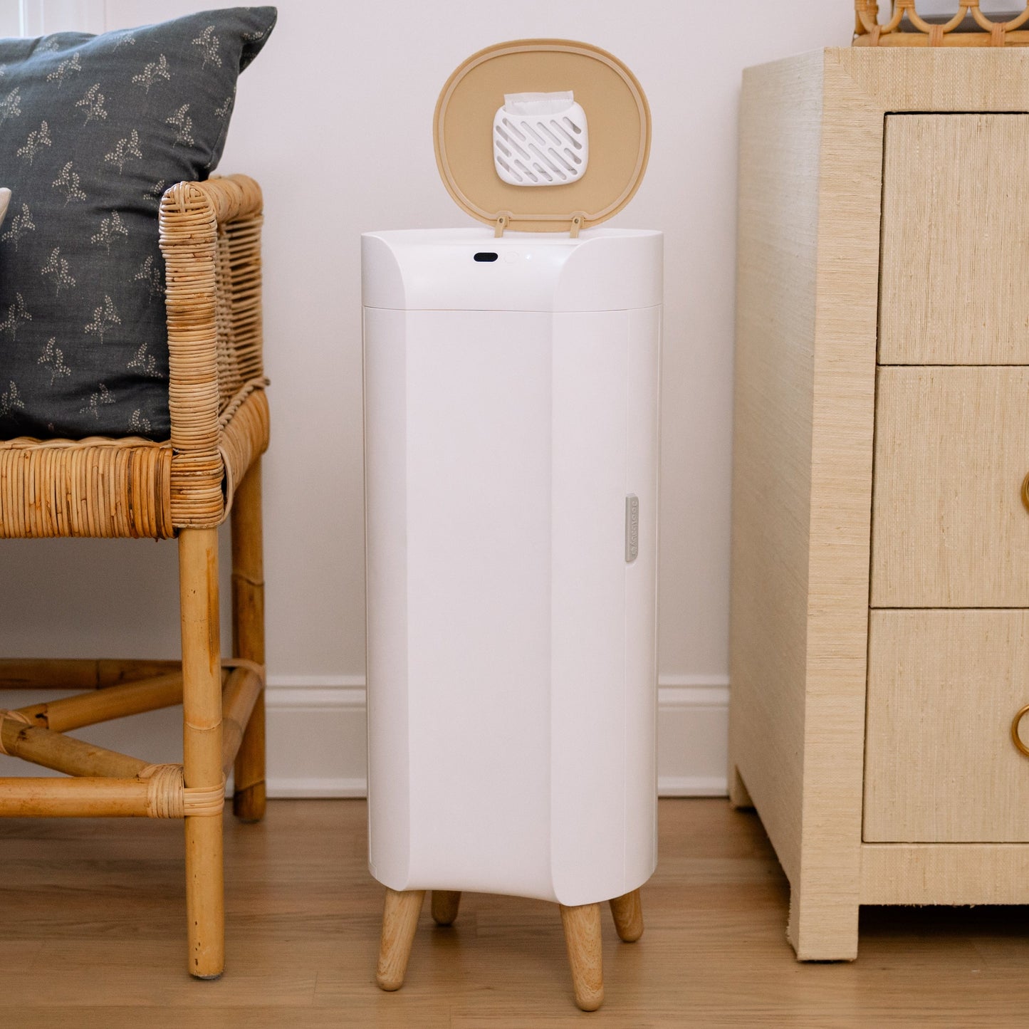 Diaper pail next to changing table