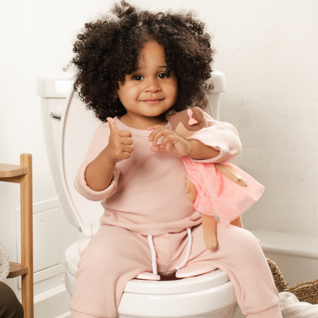 Toddler girl potty training with the foldable travel potty seat