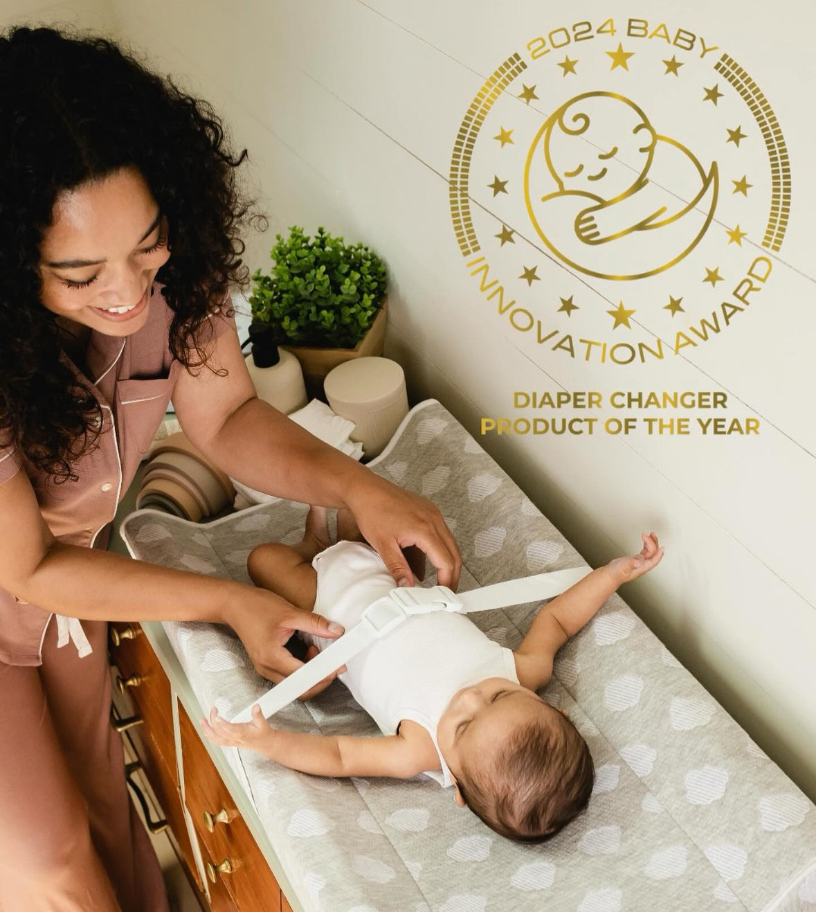 Award winning changing pad with cover in cloud design