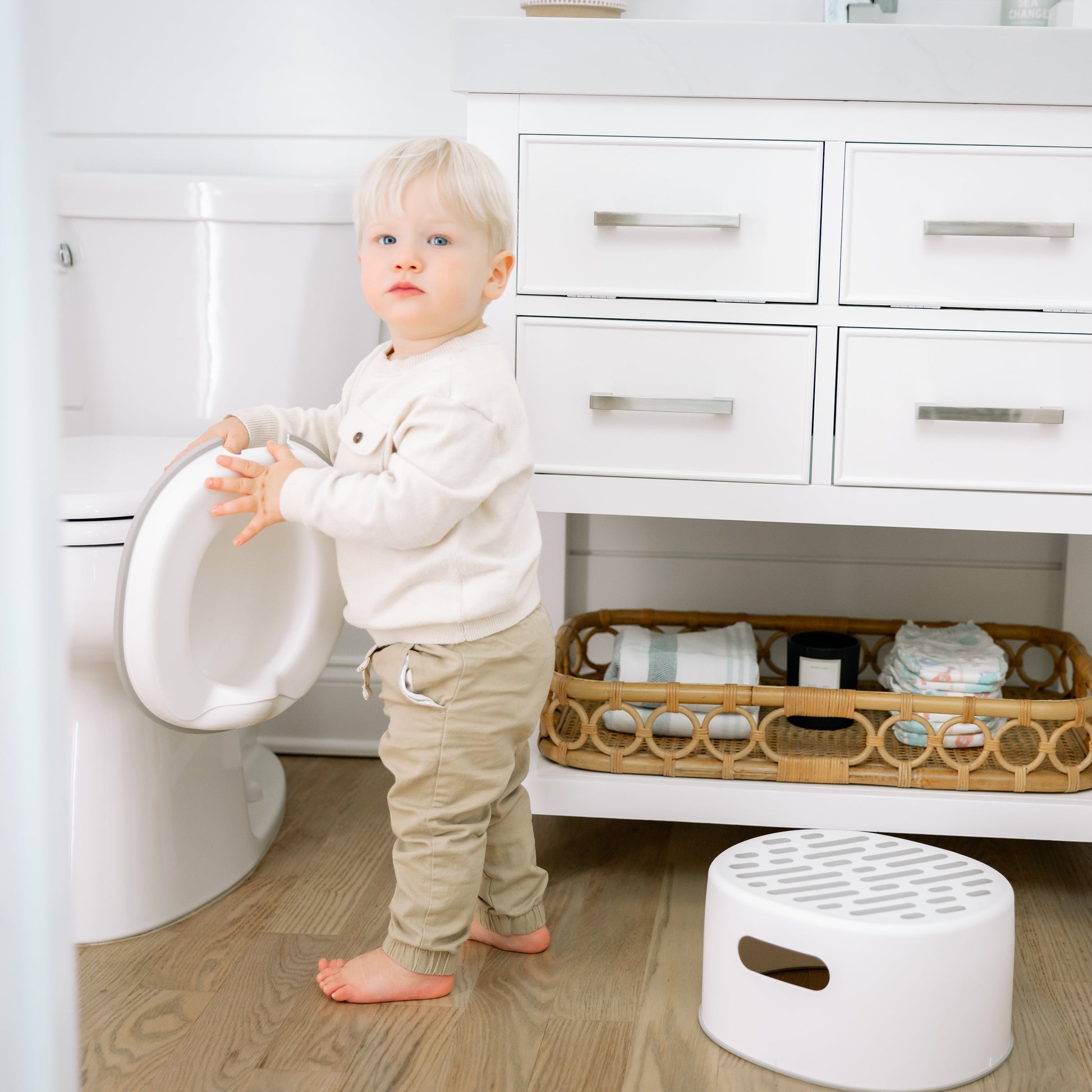 Toddler boy with potty urinal
