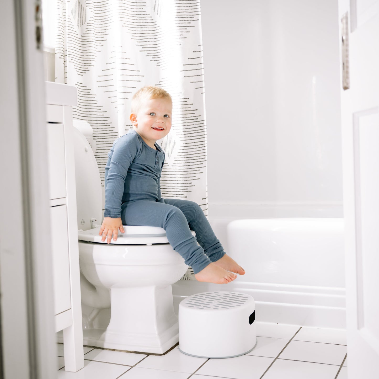 Toddler boy potty training on milestone potty seat