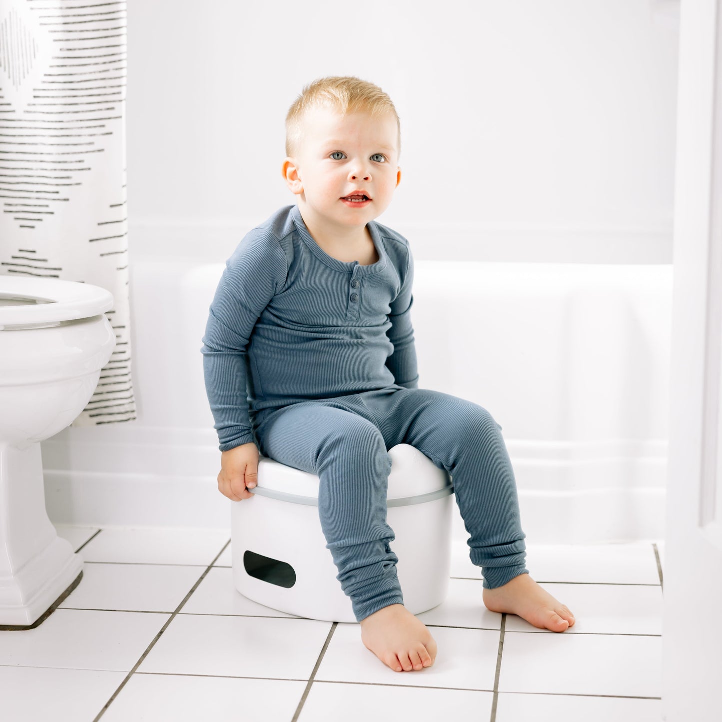 Toddler boy potty training on milestone potty chair