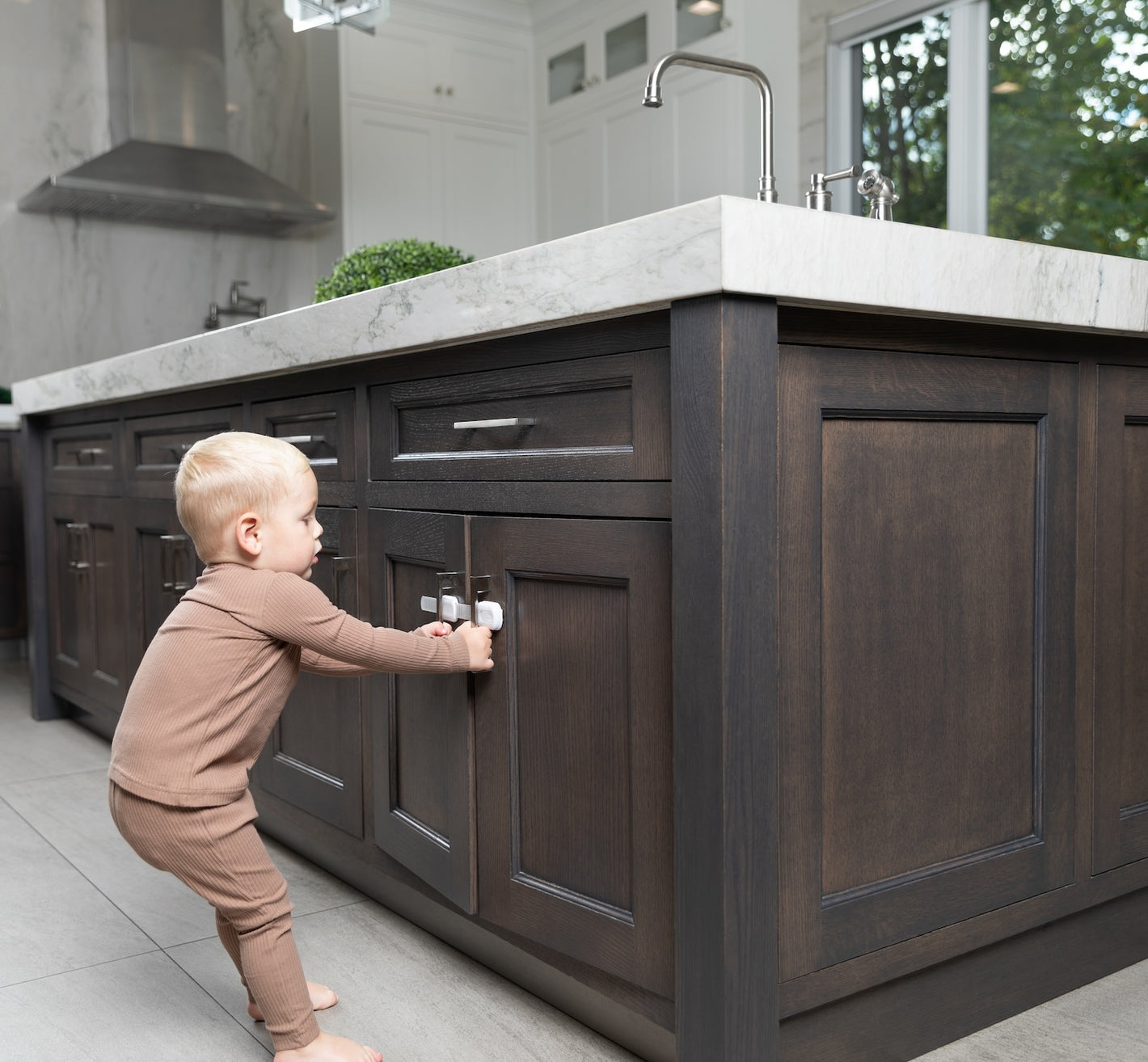 Child not able to get into cabinets with multi use strap locks