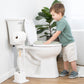 Child interacting with a toilet in a bathroom setting