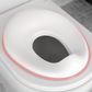 Pink potty training seat on toilet for potty training