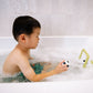 Child playing with a toy in a bathtub