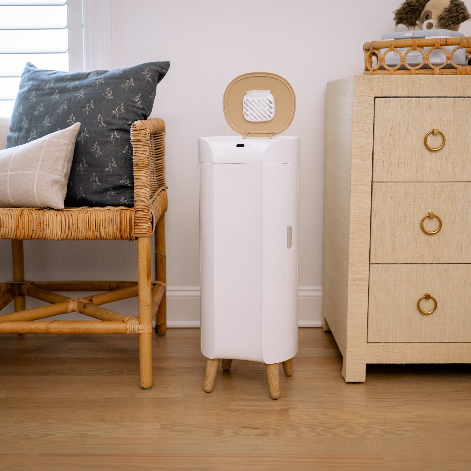 Diaper pail next to changing table